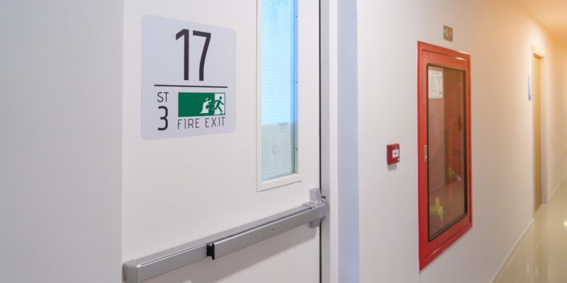 fire,extinguisher,system,on,the,wall,with,fire,exit,door